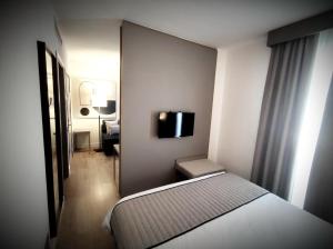 Postel nebo postele na pokoji v ubytování Vittoria Parc Hotel