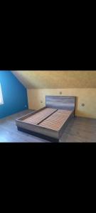 a large bed in a room with at La Clé du Bonheur in Friville-Escarbotin