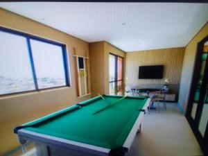 a billiard room with a pool table in it at Sweet home in Maceió