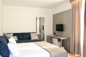 Postel nebo postele na pokoji v ubytování Vittoria Parc Hotel