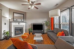 a living room with a couch and a fireplace at Suburban Family Retreat - Outdoor Garden -sleep 10 in Duluth