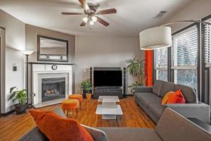 a living room with a couch and a fireplace at Entire 4br Private Home I-85 Access Family in Duluth
