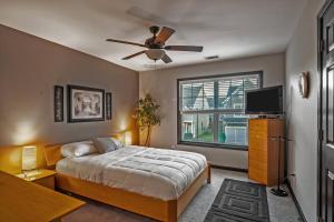 a bedroom with a bed and a ceiling fan at Suburban Family Retreat - Outdoor Garden -sleep 10 in Duluth