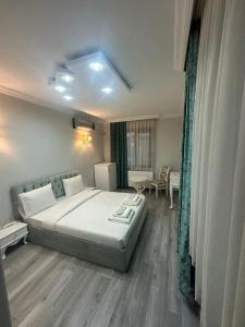 a bedroom with a large bed in a room at X SAPANCA OTEL in Sakarya