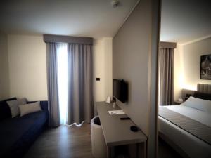 Postel nebo postele na pokoji v ubytování Vittoria Parc Hotel