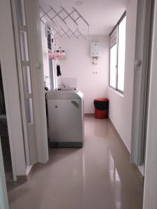 a kitchen with a small refrigerator in a room at Apartamento 3 hab 2 baños in Santa Rosa de Cabal