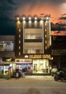 a building with a business inn in front of it at BLESS INN - Near Connaugt Place in New Delhi