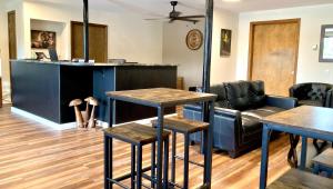 a living room with two tables and a couch at Big Horn Lodge in Grand Lake