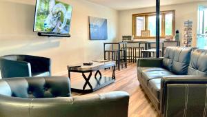 a living room with a couch and a table at Big Horn Lodge in Grand Lake