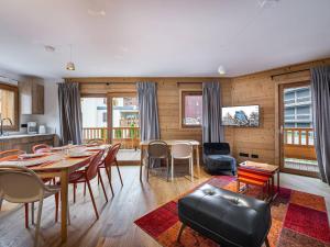 a dining room with a table and chairs at Appartement Courchevel 1650, 4 pièces, 6 personnes - FR-1-563-15 in Courchevel