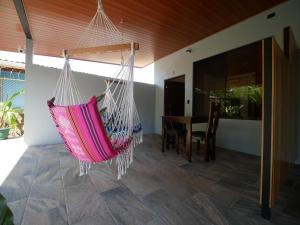 a hammock hanging from the ceiling of a house at Raya in Matapalo
