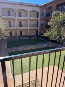 a large apartment building with a lawn in front of it at Hill Country Hiatus! in Austin