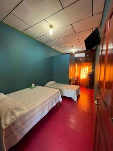מיטה או מיטות בחדר ב-Hotel Gusto Bueno