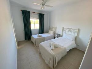 A bed or beds in a room at Terrazas de Guadalupe - Sea view