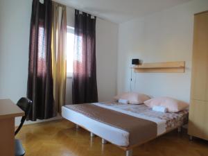 Postel nebo postele na pokoji v ubytování Apartments Kovacic