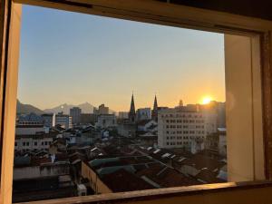 a view of a city skyline from a window at Studio Dowtown tech Rio in Rio de Janeiro