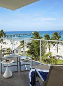 a balcony with a view of the beach and the ocean at Royal Blues Hotel in Deerfield Beach