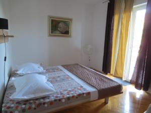 Postel nebo postele na pokoji v ubytování Apartments Kovacic