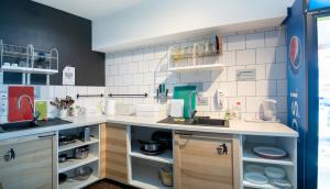 A kitchen or kitchenette at Safestay Bratislava Presidential Palace