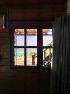 a window in a room with a curtain at el arca in Cartagena de Indias