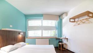 A bed or beds in a room at Safestay Bratislava Presidential Palace