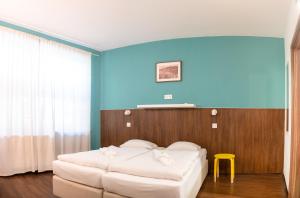 A bed or beds in a room at Safestay Bratislava Presidential Palace