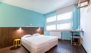 A bed or beds in a room at Safestay Bratislava Presidential Palace