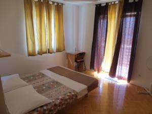 Postel nebo postele na pokoji v ubytování Apartments Kovacic