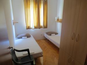 Postel nebo postele na pokoji v ubytování Apartments Kovacic