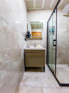 a bathroom with a sink and a shower at Dem Premium Hotel - Round Trip Airport Service - Istanbul International Airport in Arnavutköy