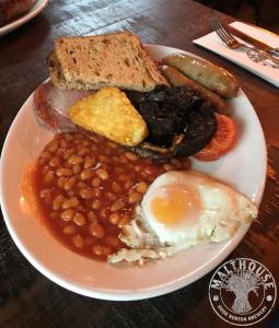 a plate of food with beans and eggs and bread at The Crown Inn at Benson in Wallingford