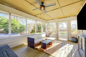 a screened in porch with a couch and a table at Pooler Praline - 5BR - Sleeps 12 (Close to Savannah & Airport) in Savannah