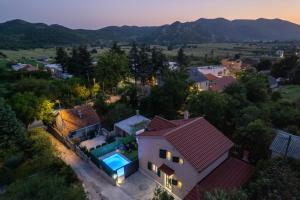 an aerial view of a house with a swimming pool at Villa Viktoria with private swimming pool in Donji Muć