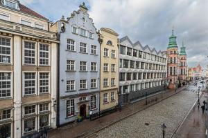 a row of buildings on a city street at Neptun - BillBerry Apartments in Gdańsk