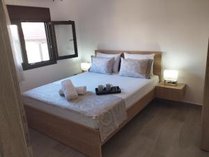 Postel nebo postele na pokoji v ubytování GRAMMENOS HOUSE