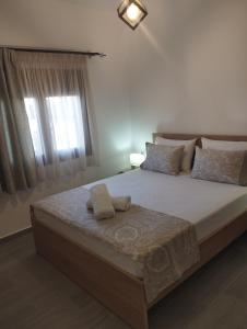 Postel nebo postele na pokoji v ubytování GRAMMENOS HOUSE