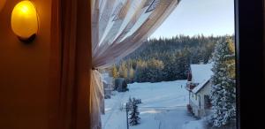 Pokoje Apartamenty Pod Limbą v zime