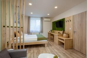 Ένα ή περισσότερα κρεβάτια σε δωμάτιο στο Bauer Resort Countryside Retreat