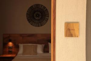 Cama ou camas em um quarto em Heura Petit Hotel