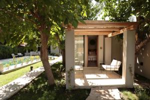 Um jardim em Heura Petit Hotel