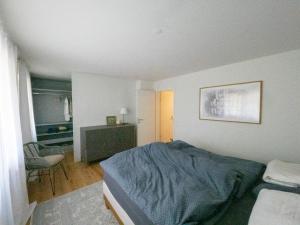 Ein Bett oder Betten in einem Zimmer der Unterkunft Exclusive Unterkunft in 15min bis Hallenstadion - Zürich City - Flughafen ZH