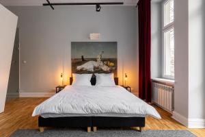 Llit o llits en una habitació de Chełmońskiego 8-03 by Farkas Apartments