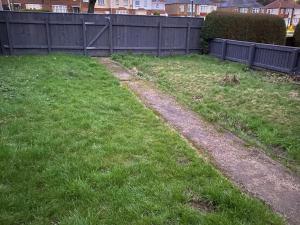 a field of grass with a fence and a dirt road at Wellbank View - Brand New in Washington