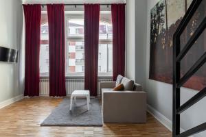 Χώρος καθιστικού στο Chełmońskiego 8-04 by Farkas Apartments