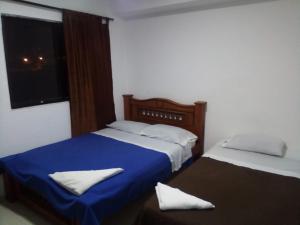 Postel nebo postele na pokoji v ubytování Hotel Palma Real Cartagena