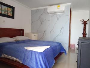 Postel nebo postele na pokoji v ubytování Hotel Palma Real Cartagena