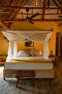 a bedroom with a bed with a canopy at Eco Xata in Santa Veronica