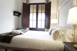 מיטה או מיטות בחדר ב-Hospedarte Cazadero Real