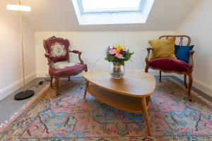 Ein Sitzbereich in der Unterkunft Li Ter Hôtel