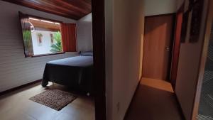 Postel nebo postele na pokoji v ubytování Sítio Encontro das Águas Brotas